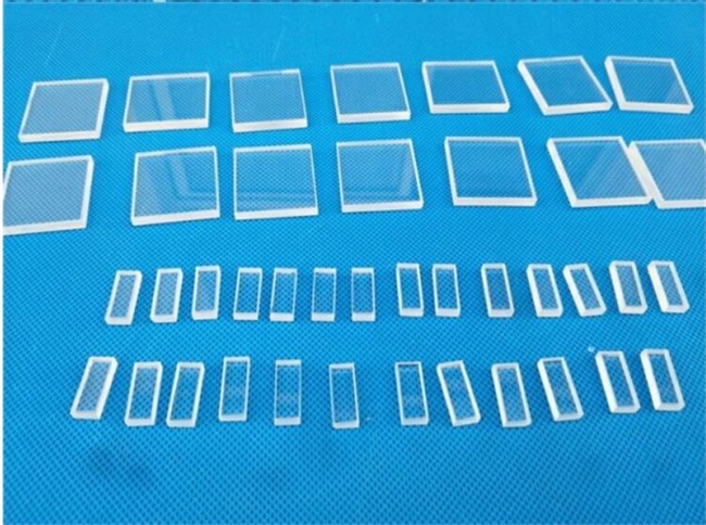 Precision perforated quartz glass window pieces